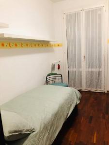Postel nebo postele na pokoji v ubytování Il Gelsomino; appartamento ampio e luminoso
