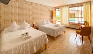 Tempat tidur dalam kamar di Esperanza Hotel - Oxapampa