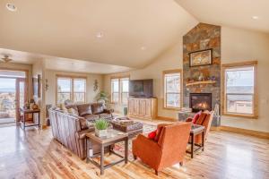a living room with a couch and a fireplace at High Desert and Cascade Views - Meredith Lodging in Redmond