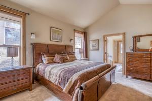 a bedroom with a bed and a dresser and a mirror at High Desert and Cascade Views - Meredith Lodging in Redmond +49 photos