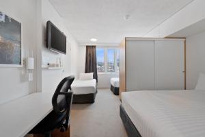 Postel nebo postele na pokoji v ubytování Allurity Hotel