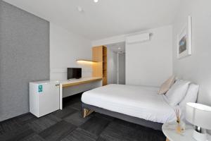Postel nebo postele na pokoji v ubytování Allurity Hotel