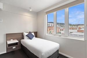 Postel nebo postele na pokoji v ubytování Allurity Hotel