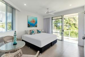 Ένα ή περισσότερα κρεβάτια σε δωμάτιο στο Allure on Hamilton Island by HIHA +33 φωτογραφίες