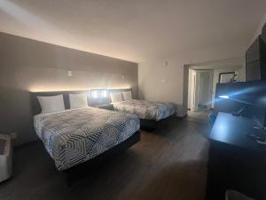 Кровать или кровати в номере Motel 6 Glendale Phoenix