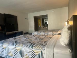 Кровать или кровати в номере Motel 6 Glendale Phoenix