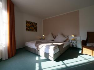 Postel nebo postele na pokoji v ubytování Hotel Bremer
