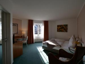 Postel nebo postele na pokoji v ubytování Hotel Bremer