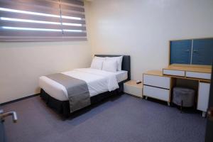 Letto o letti in una camera di Cube9 Resort & Spa 큐브9 리조트 & 스파