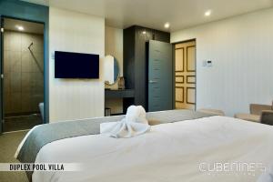 Letto o letti in una camera di Cube9 Resort & Spa 큐브9 리조트 & 스파