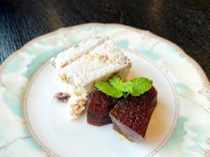 a plate with a piece of cake on a plate at Hotel Shinanoji in Nagano