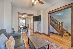 a living room with a couch and a table at 4BR+Parking central townhouse walk to metro&shops in Washington, D.C.