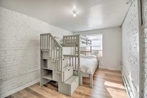 a loft bedroom with a bunk bed and a ladder at 4BR+Parking central townhouse walk to metro&shops in Washington, D.C.