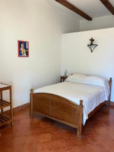 Voodi või voodid majutusasutuse La Casa de Cafe Bed and Breakfast toas