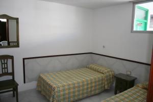 A bed or beds in a room at Apartamentos Maba Playa Még 7 kép