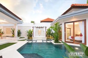 a villa with a swimming pool in a house at Villa Mia Seminyak - Boutique Villas in Seminyak