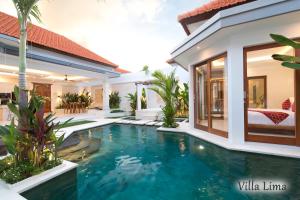 a swimming pool in the backyard of a villa at Villa Mia Seminyak - Boutique Villas in Seminyak