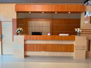 a lobby with a reception desk in a building at Wisma Jannatun Naim Lampung in Lampung