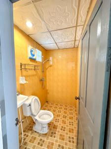 a bathroom with a toilet and a sink at Chaliya Boutique Garden in Luang Prabang