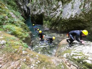 a group of people in the water in a cave at Kozorog Durmitor in Žabljak