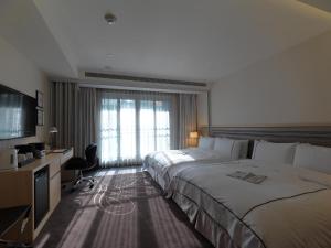Voodi või voodid majutusasutuse K Hotel Taipei Songjiang toas