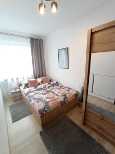 Posteľ alebo postele v izbe v ubytovaní MK Apartament IV