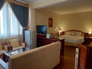 Postel nebo postele na pokoji v ubytování Palace Hotel Vung Tau