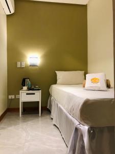 Postel nebo postele na pokoji v ubytování NGN Gran Hotel