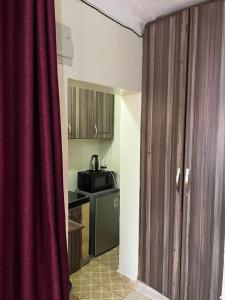 Cuina o zona de cuina de Pearl suites - Bukoto