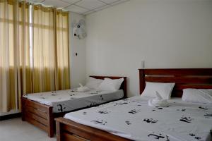 Postel nebo postele na pokoji v ubytování Paramata Accommodation