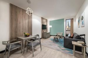 a living room with a couch and a table at Holiday Inn Riyadh Al Qasr, an IHG Hotel in Riyadh