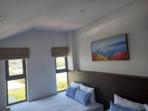 Postel nebo postele na pokoji v ubytování KP Villa Dalat