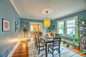 a dining room with a table and chairs at Cozy, Updated Rocky Mt Home by City Lake Park in Rocky Mount