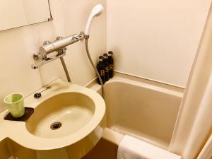 a small bathroom with a toilet and a sink at Life is Beautiful - Vacation STAY 94973 in Hachimantai