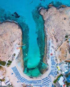 an aerial view of a green body of water at Nissi49 Apartments in Ayia Napa