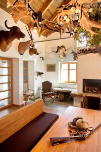 a living room with antlers on the ceiling at Lovecká chata VRŠAVA in Koryčany