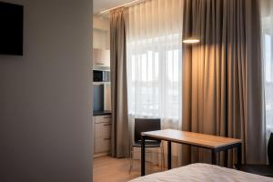 a hotel room with a table and a window at Espak Hostel in Tallinn