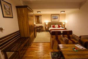 Ένα ή περισσότερα κρεβάτια σε δωμάτιο στο Atithi Resort & Spa