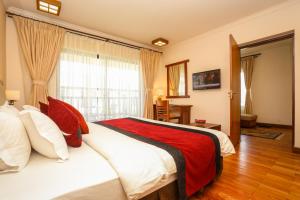 Ένα ή περισσότερα κρεβάτια σε δωμάτιο στο Atithi Resort & Spa