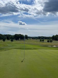 a view of a golf course with a putting green at Strand Golf in Harad