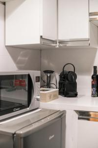 A kitchen or kitchenette at Campo de' Fiori appartamento via di Grotta Pinta