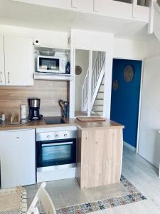 Dapur atau dapur kecil di Bella vista ,accès direct plage, front de mer, vue mer panoramique