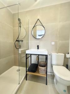 Et badeværelse på Appartement Gabriel Centre ville départ Ferry