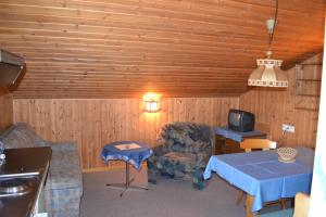 a living room with a couch and a table and a tv at Appartementhaus Anny in Vent