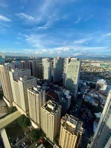 an aerial view of a city with tall buildings at AFFORDABLE StayCation EASTWOOD CITY in Manila