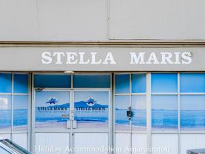 a building with the sign for stella maris on it at Holiday Accommodation Amanzimtoti in Amanzimtoti