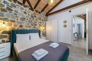 Posteľ alebo postele v izbe v ubytovaní Petra Residence