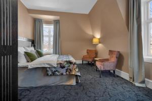 Postel nebo postele na pokoji v ubytování Home Hotel Gabelshus