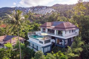 an aerial view of a house with solar panels on it at Monkey Villa Chaweng Noi koh samui in Koh Samui 