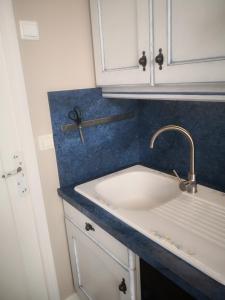 a kitchen with a sink and aaucet at Les 5 balcons in Le Tréport +27 photos